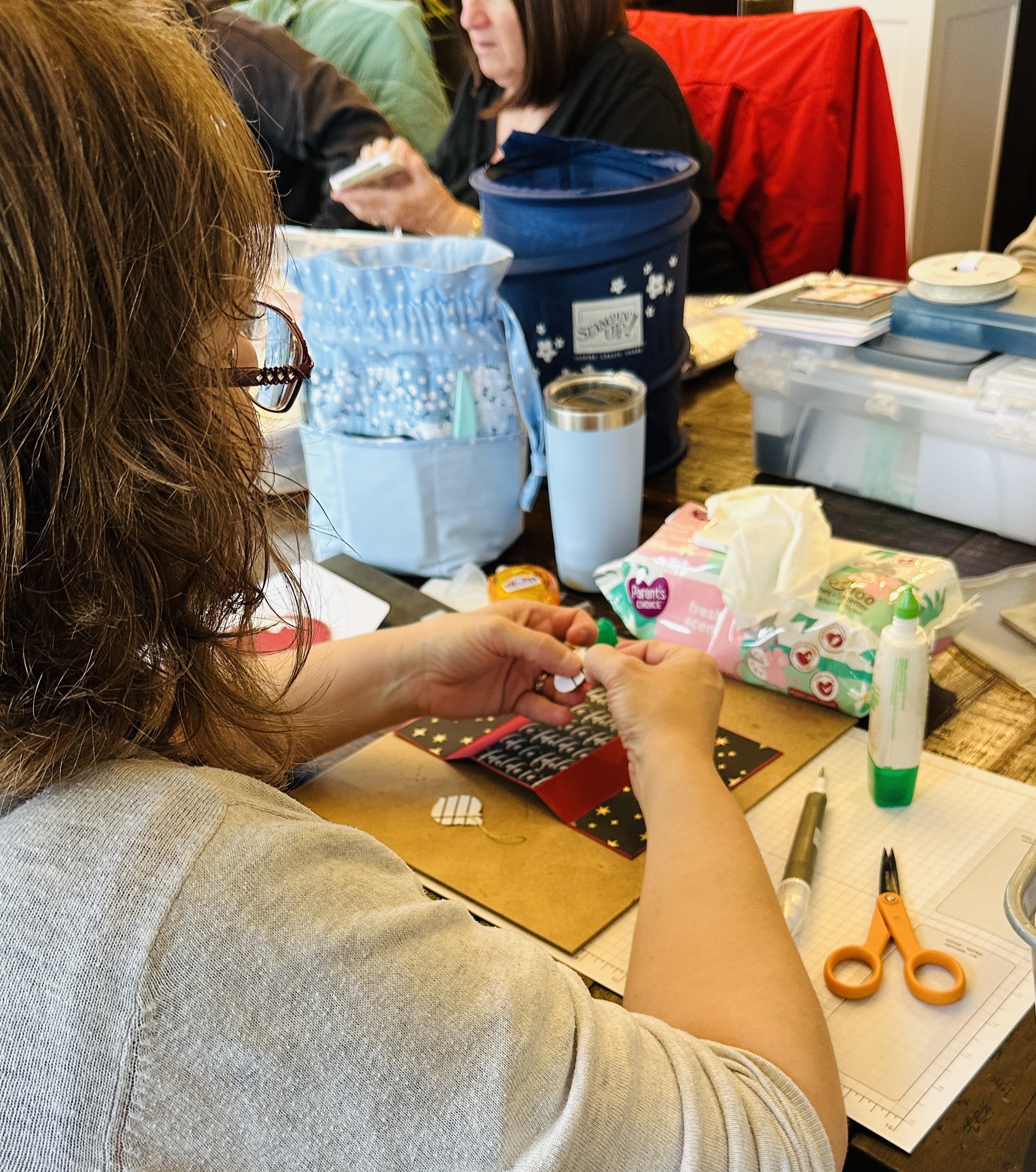 Tanya crafting at her table
