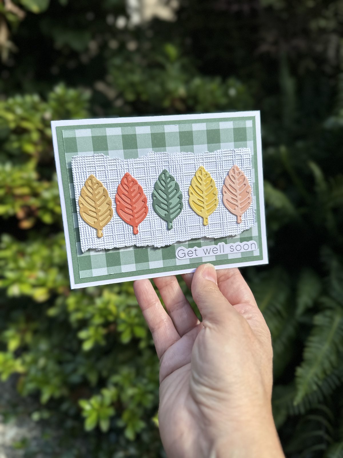 Handmade Get Well Soon card with five multicoloured Elegant Leaves die cuts on a woven embossed panel