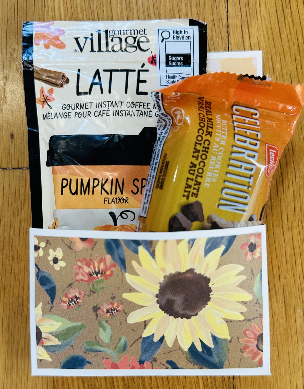 Fall treat holder card with a sunflower paper pocket holding a pumpkin spice latte sachet and a wrapped butter cookie
