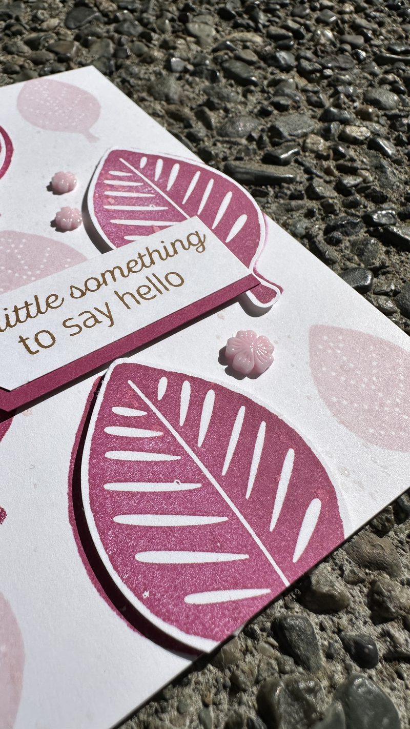 Handmade card with layered pink Berry Burst leaves and Bubble Bath background leaves, sentiment reads a little something to say hello